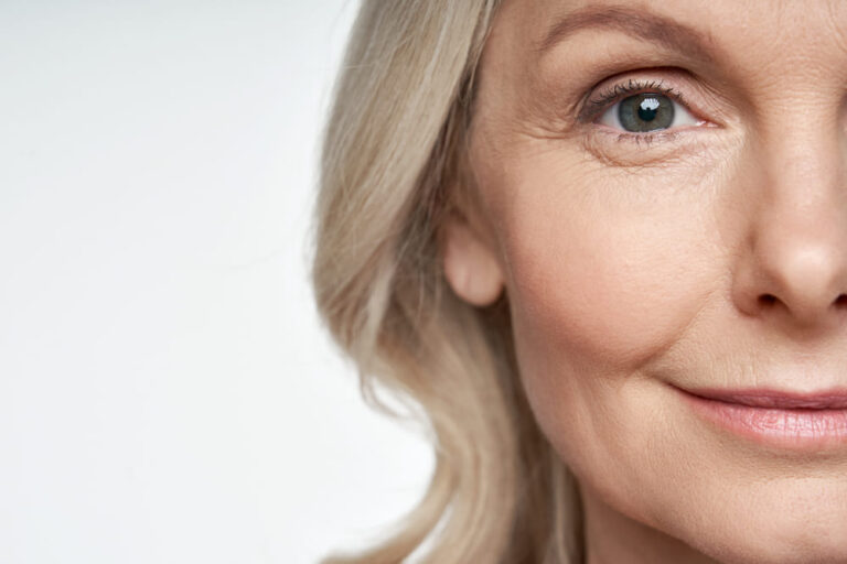 50s middle aged old woman looking at camera advertising dry skin care treatment