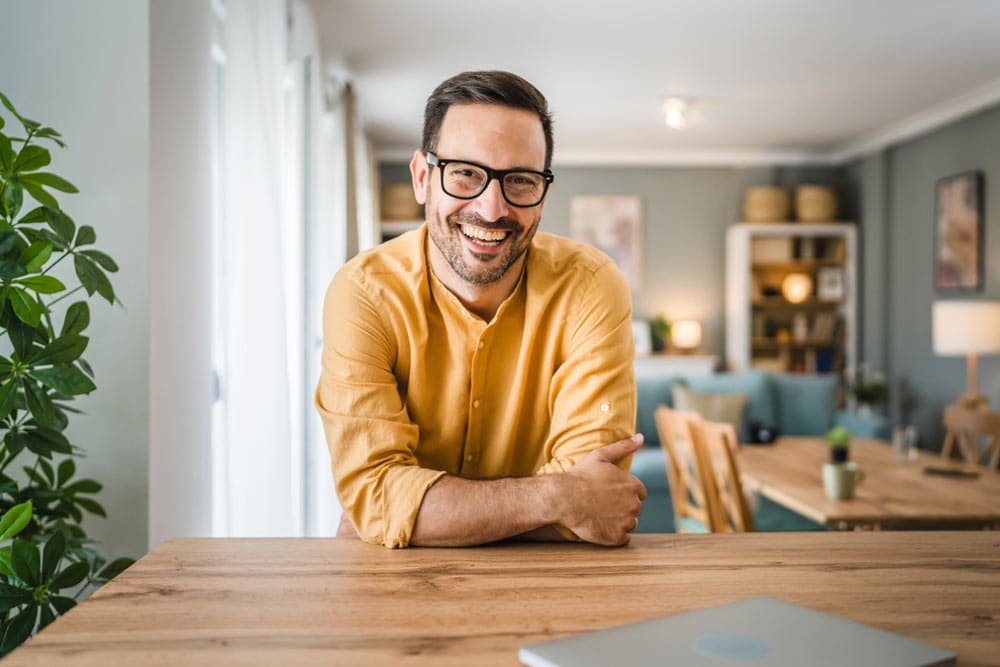 One man adult caucasian male with beard and eyeglasses stand at home