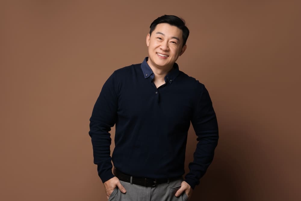 Portrait of happy man on brown background