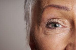 close-up detail of mature woman with green eyes