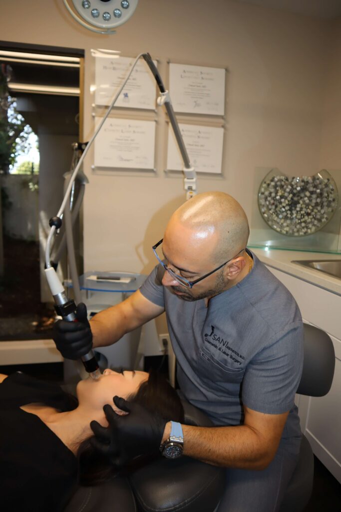 Dr. Omeed Sani doing laser skin resurfacing or treatment